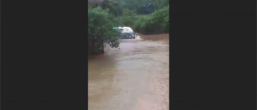 Lorry moving through the river-road (Video)