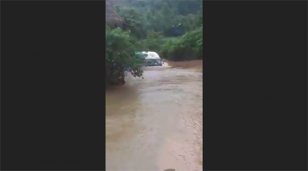 Lorry moving through the river-road (Video)