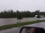 A truck driver driving through dangerously flooded road - Pegagu
