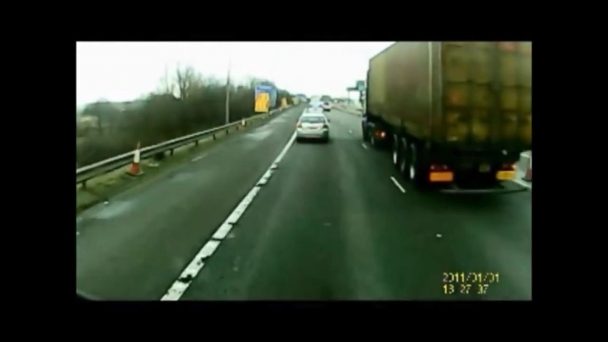 Lorry changing lanes pushes a car off the road