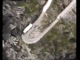 Lorry travelling through tiny roads on mountains - Pegagu