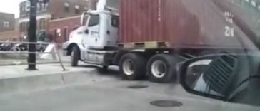 Trucker fails turning into the road (Video)