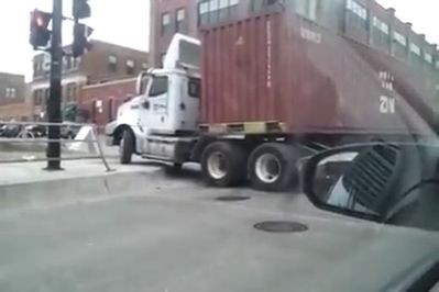 Trucker fails turning into the road (Video)