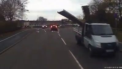 Unstrapped steel bars on a van hits the oncoming vehicle (Video)