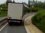 Lorry carrying a load dangerously hanging on a curtain (Video)