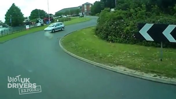 Car driver driving on a wrong roundabout side (Video)